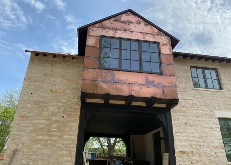 Copper metal panel facade on a stone building for Metal Roof Coating in Kaiminani