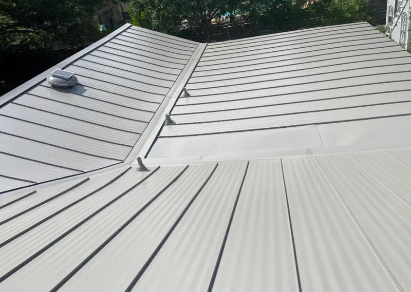 Solar attic fan installed on a metal roof for Roof Ventilation in Kaiminani